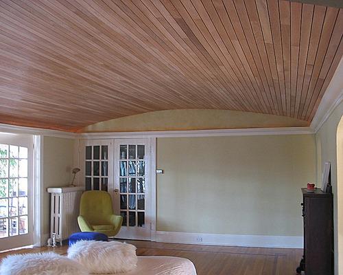 A photo of a room with a vaulted (arched) ceiling overed in wood.